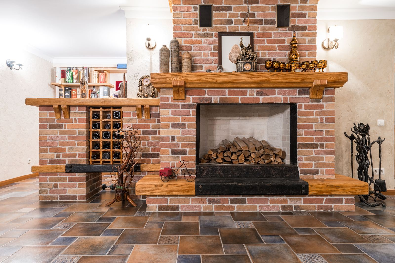 A brick chimney breast and open fireplace in a living room