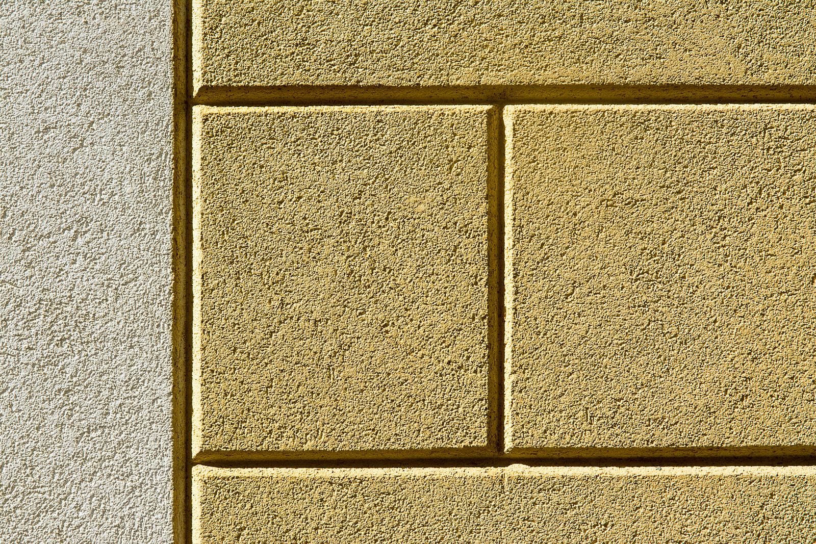 A rendered house elevation part way through a silicone thin coat topcoat