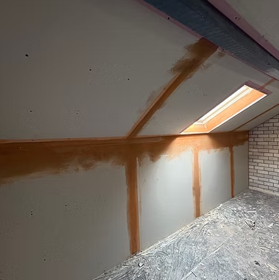 Loft room dry lined in plasterboard with the joints taped and filled ready for decoration