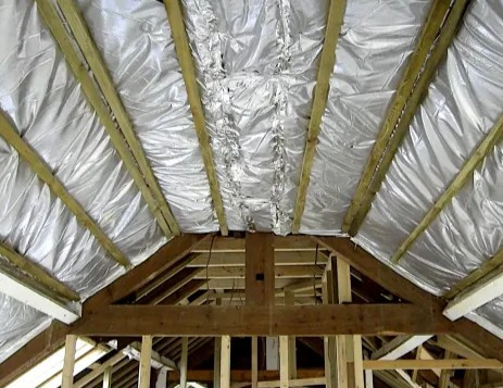 Foil faced membrane fitted under the roof covering above the rafters