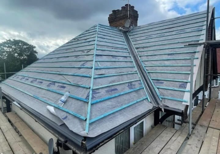 Breathable membrane and new treated battens fixed over a roof before the covering goes back on